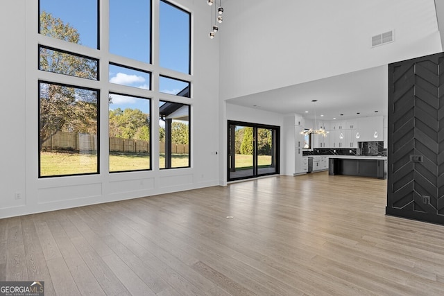 unfurnished living room featuring light hardwood / wood-style floors