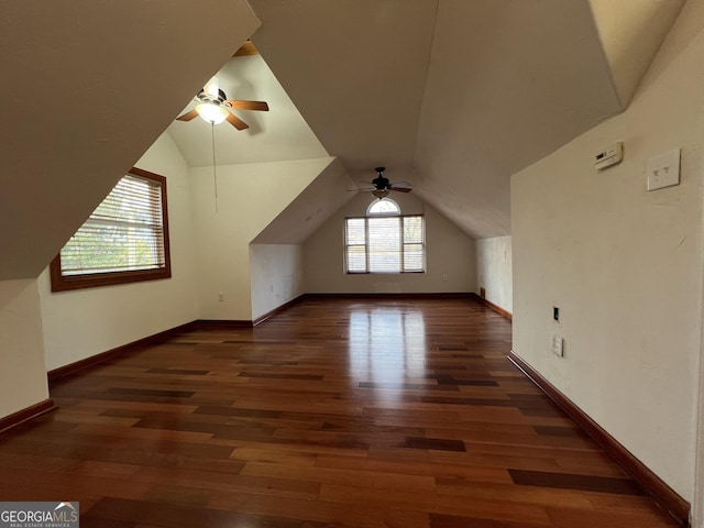 bonus room with dark wood-type flooring, ceiling fan, and vaulted ceiling