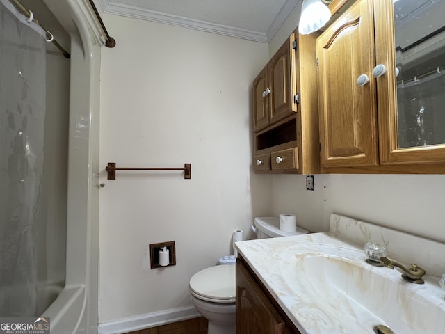 bathroom with vanity, ornamental molding, and toilet