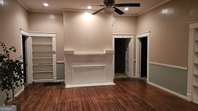 unfurnished living room featuring ornamental molding, dark wood-type flooring, and ceiling fan