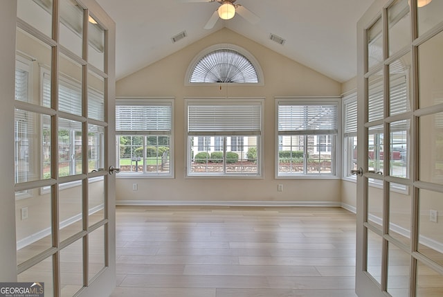 unfurnished sunroom featuring french doors, ceiling fan, and vaulted ceiling