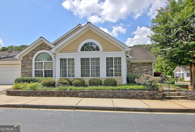 ranch-style home featuring a garage