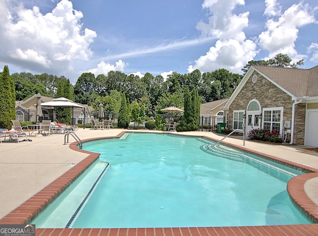 view of swimming pool featuring a gazebo and a patio area