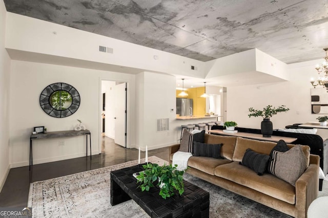 living room with a notable chandelier