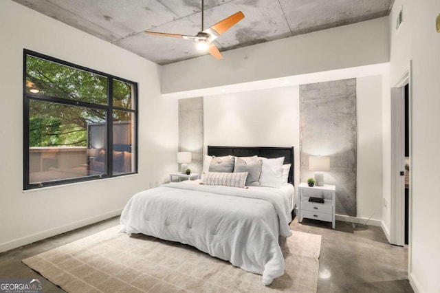 bedroom featuring concrete floors and ceiling fan