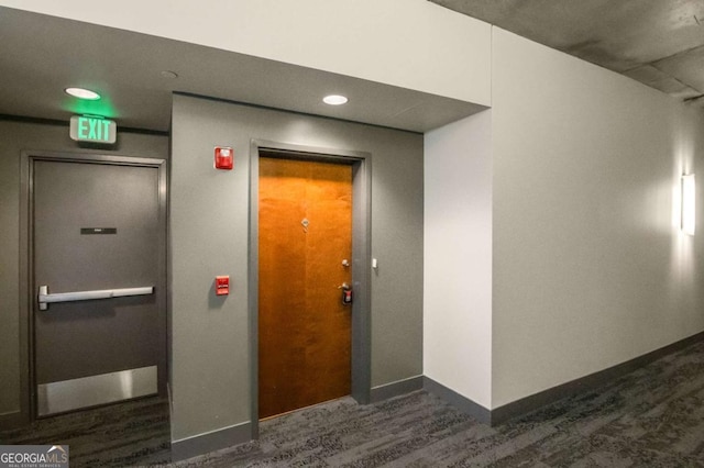 corridor featuring dark hardwood / wood-style flooring