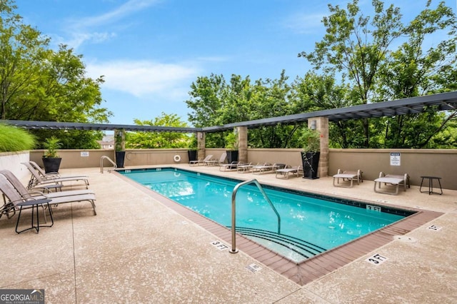 view of pool featuring a patio