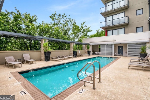 view of pool featuring a patio area