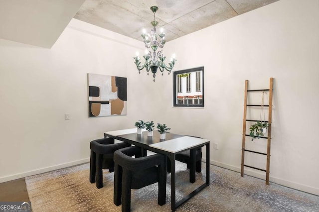 dining space with a chandelier