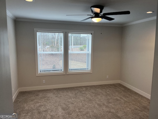 unfurnished room with crown molding, ceiling fan, and carpet flooring