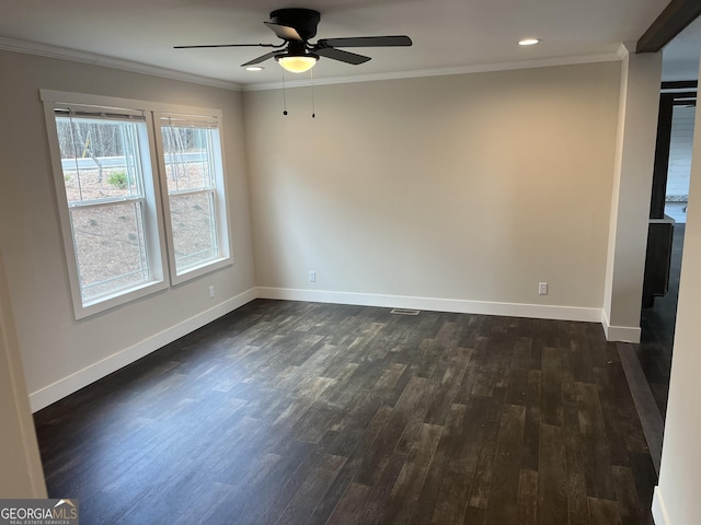 empty room with ornamental molding, dark hardwood / wood-style floors, and ceiling fan