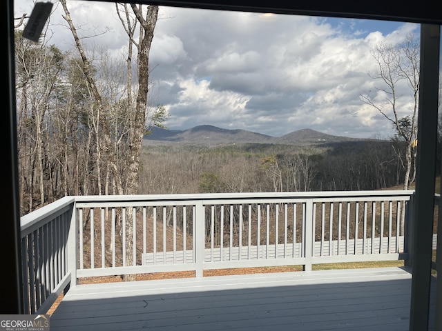 wooden terrace with a mountain view