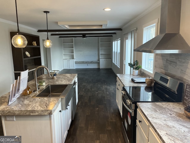 kitchen with electric stove, wall chimney exhaust hood, crown molding, and hanging light fixtures