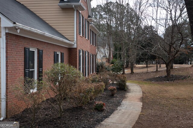 view of side of home featuring a deck