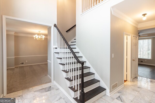 stairs featuring ornamental molding, wood-type flooring, and a high ceiling