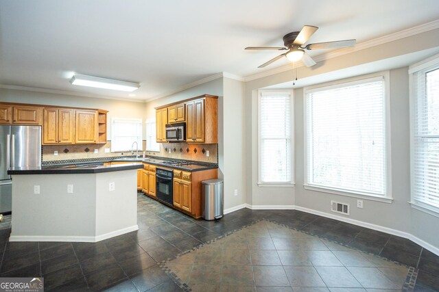 unfurnished living room with built in shelves, ceiling fan, crown molding, and decorative columns