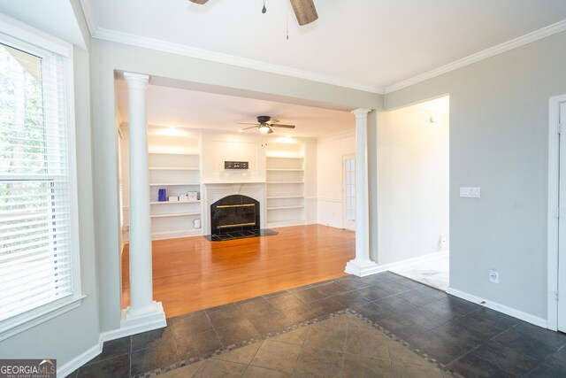 kitchen featuring appliances with stainless steel finishes, sink, decorative backsplash, a center island, and crown molding