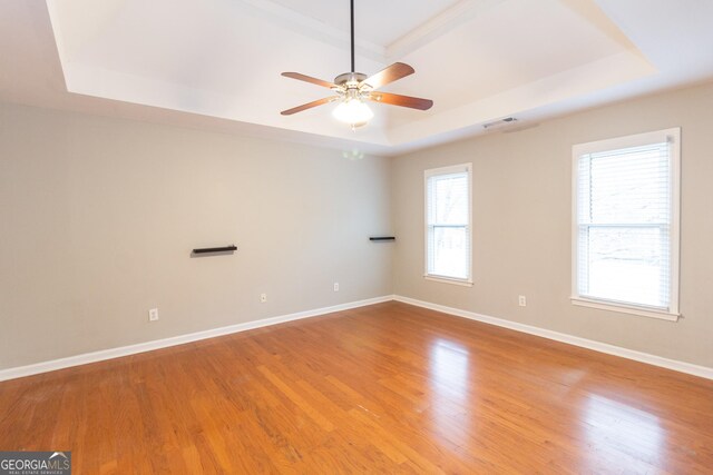 corridor featuring crown molding, dark hardwood / wood-style floors, and a notable chandelier