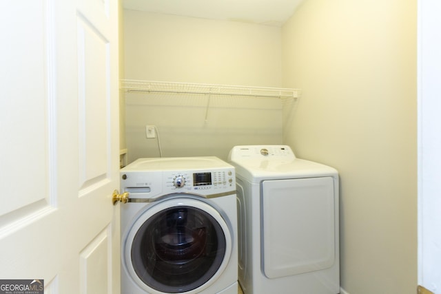 washroom featuring laundry area and independent washer and dryer