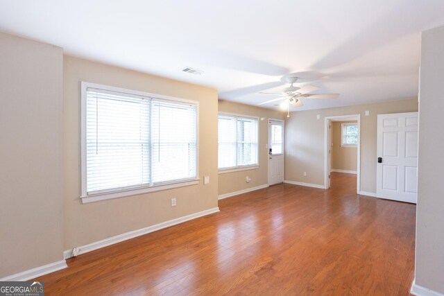 empty room with ceiling fan and carpet