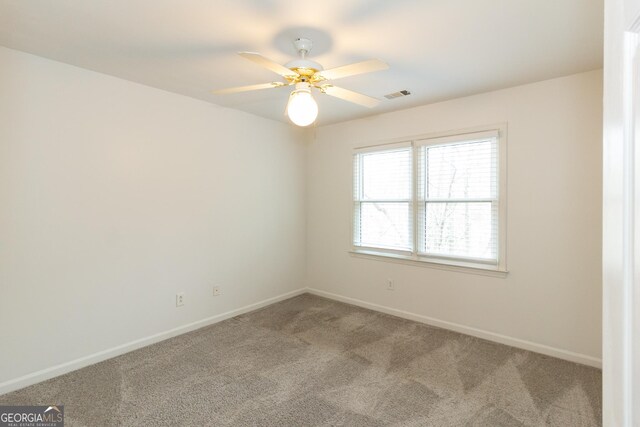 unfurnished bedroom featuring light colored carpet, a closet, and ceiling fan