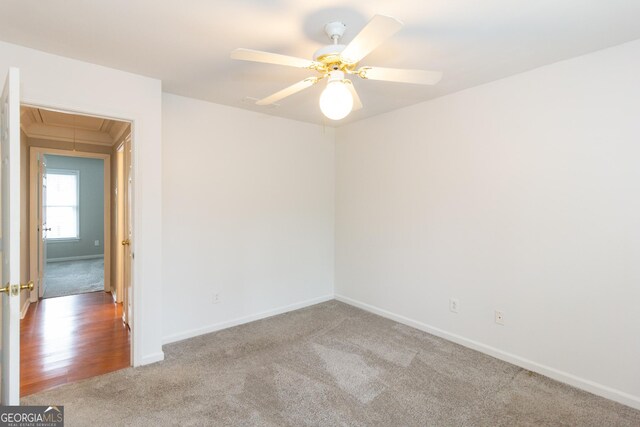 spare room featuring carpet floors and ceiling fan