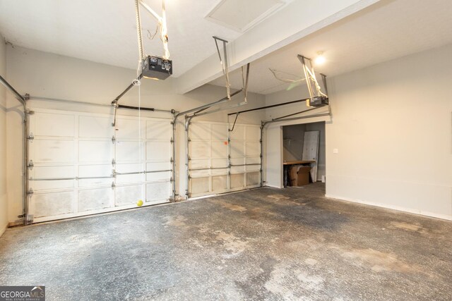 garage with a garage door opener and washing machine and dryer