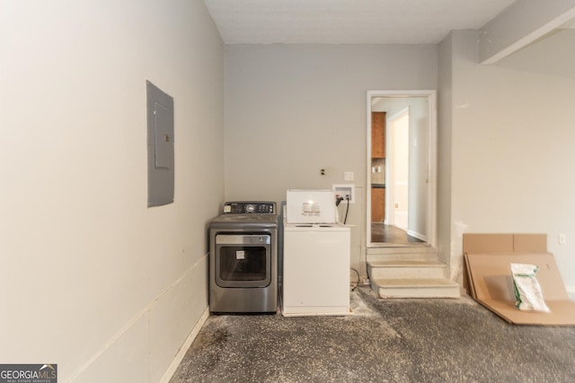 clothes washing area featuring electric panel and independent washer and dryer