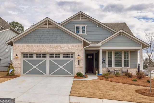 craftsman-style house with a porch and a garage