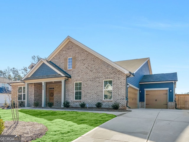 view of front facade with a garage and a front yard