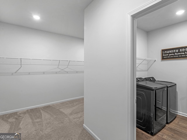 spacious closet with independent washer and dryer and carpet