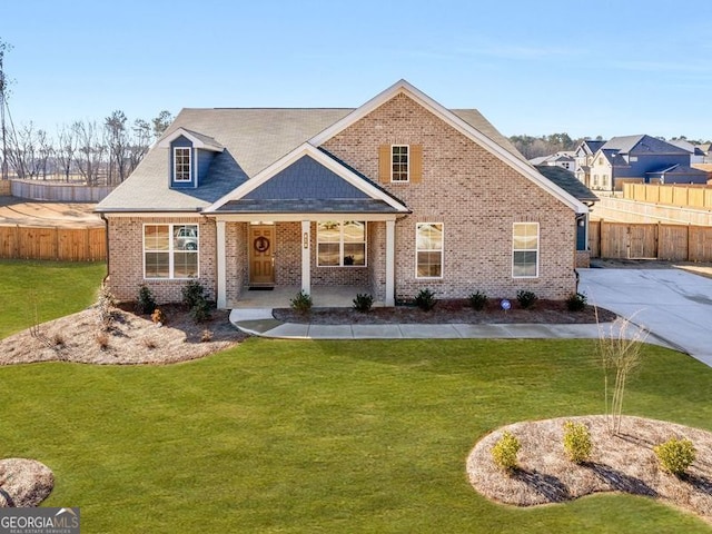 view of front of home featuring a porch and a front lawn