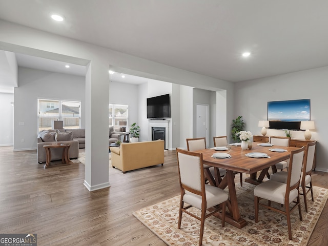 dining space with hardwood / wood-style flooring