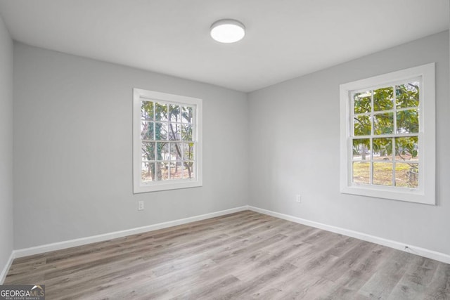 spare room featuring light hardwood / wood-style floors