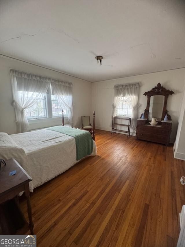 bedroom featuring hardwood / wood-style flooring