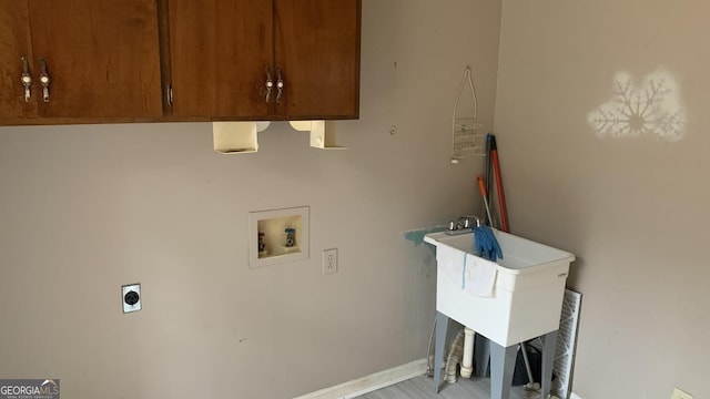 laundry area featuring cabinets, electric dryer hookup, and washer hookup