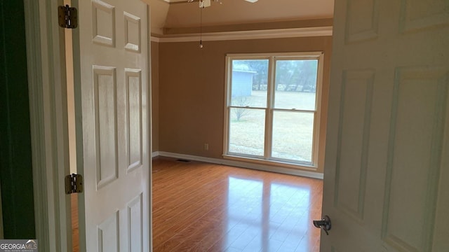 empty room with a healthy amount of sunlight and light hardwood / wood-style floors