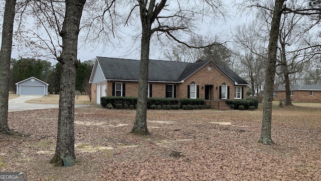 view of front of home featuring a garage and an outdoor structure