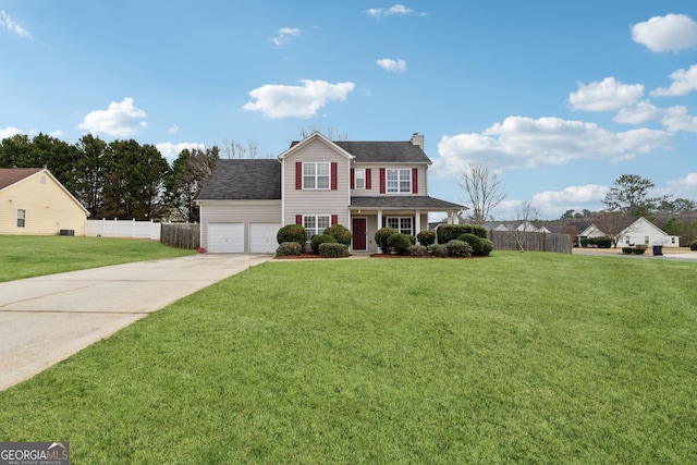 view of front of home with a garage and a front yard