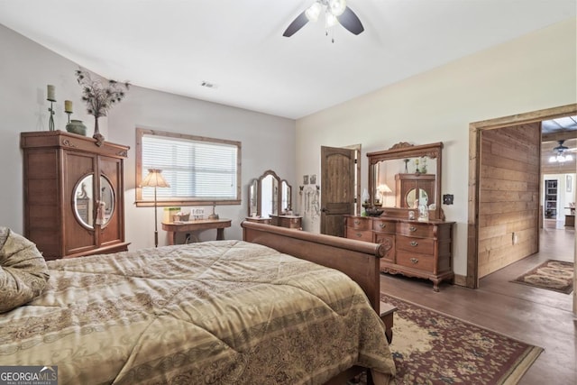 bedroom with dark wood-type flooring and ceiling fan