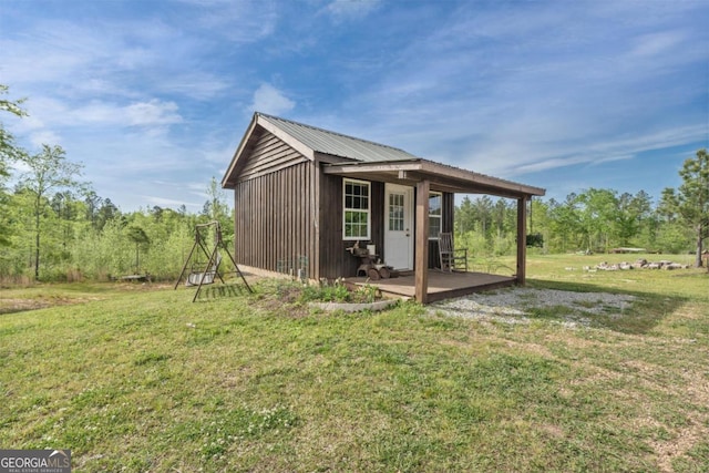 view of outdoor structure with a yard