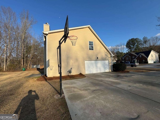 view of side of property featuring a garage