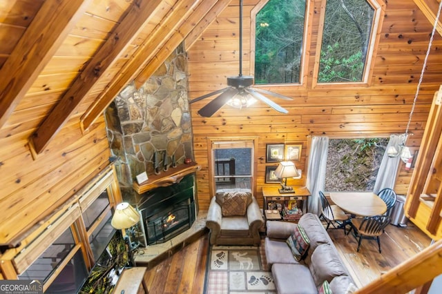 425 River Bend Ct, Ellijay, GA 30540 - living room with a fireplace, hardwood / wood-style flooring, wood walls, a ceiling fan, and vaulted ceiling