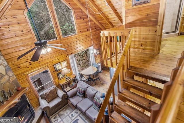 425 River Bend Ct, Ellijay, GA 30540 - living area with wood ceiling, wooden walls, ceiling fan, and wood finished floors