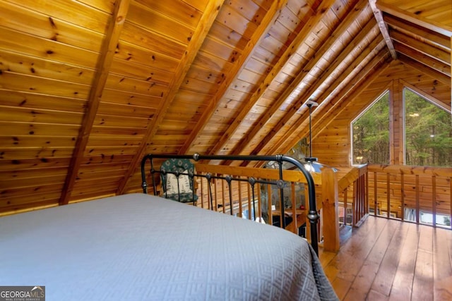 bedroom featuring wooden ceiling, wooden walls, hardwood / wood-style floors, and vaulted ceiling with beams