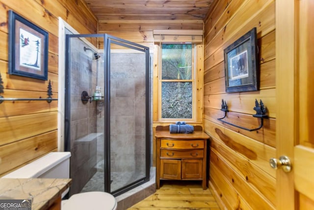 bathroom featuring walk in shower, wooden ceiling, and wood walls