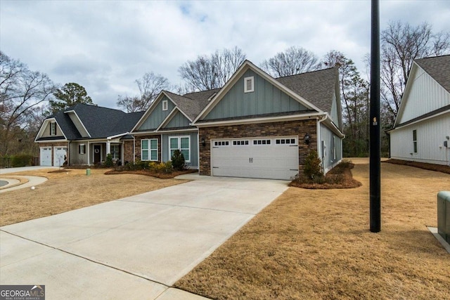 craftsman-style home with a garage and a front yard