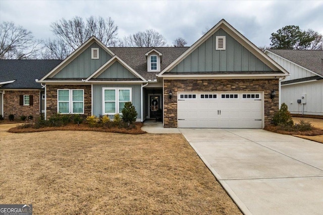 craftsman inspired home featuring a garage and a front lawn