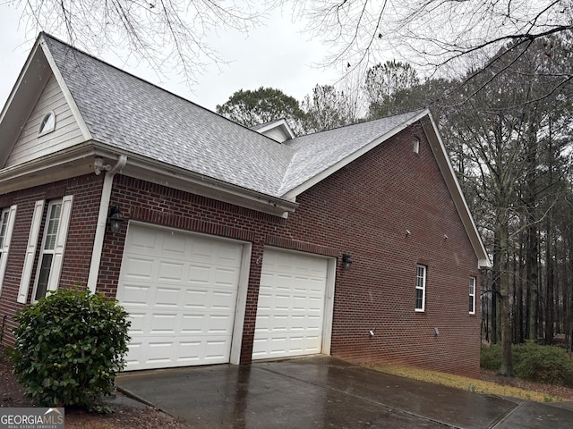 view of side of property featuring a garage