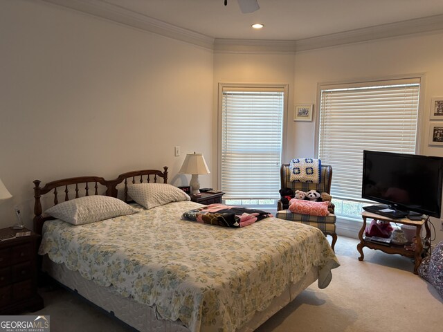 carpeted bedroom with recessed lighting, crown molding, and a ceiling fan